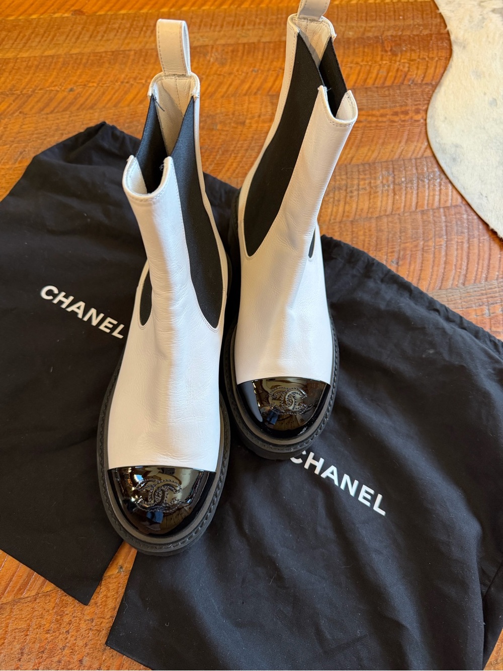 CHANEL Women’s White Leather Chelsea Boots with Black Patent Toe